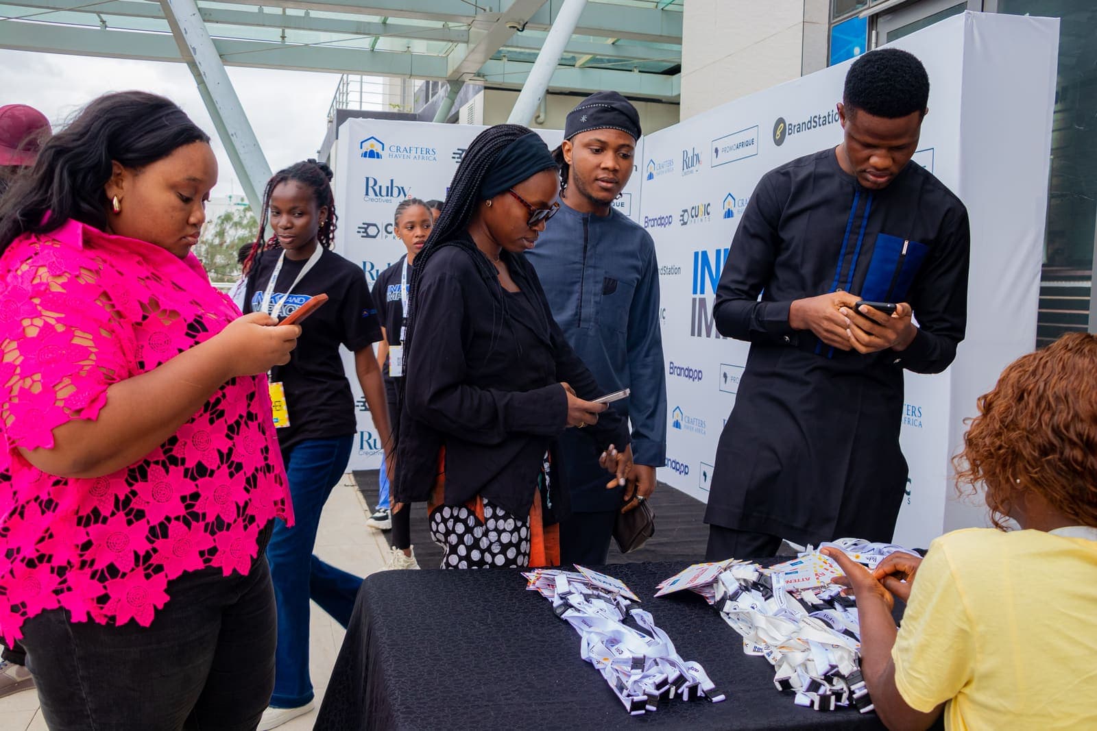 Members arriving at the Ink & Impact 1.0 welcome table