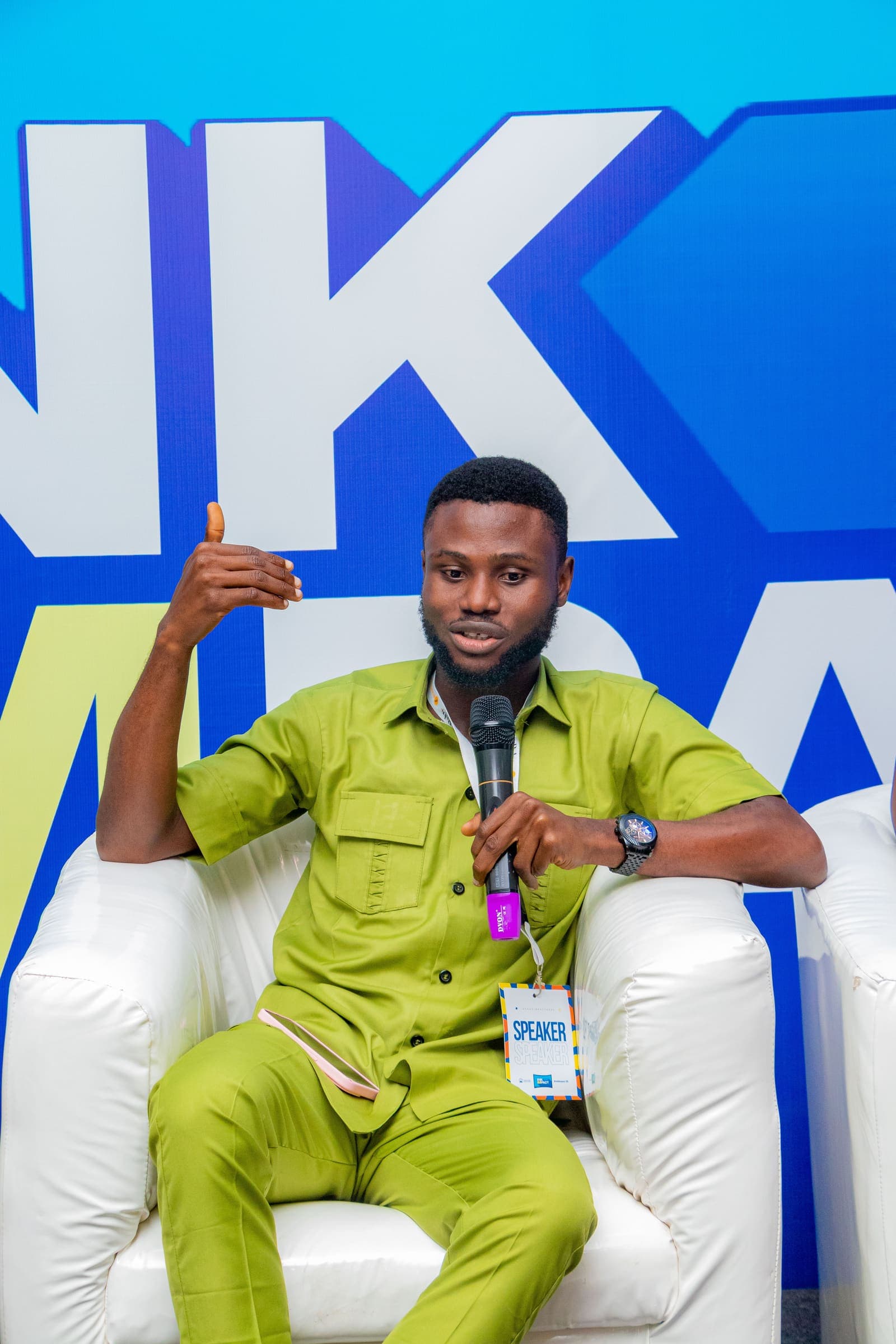 A speaker answering from the panel sofa