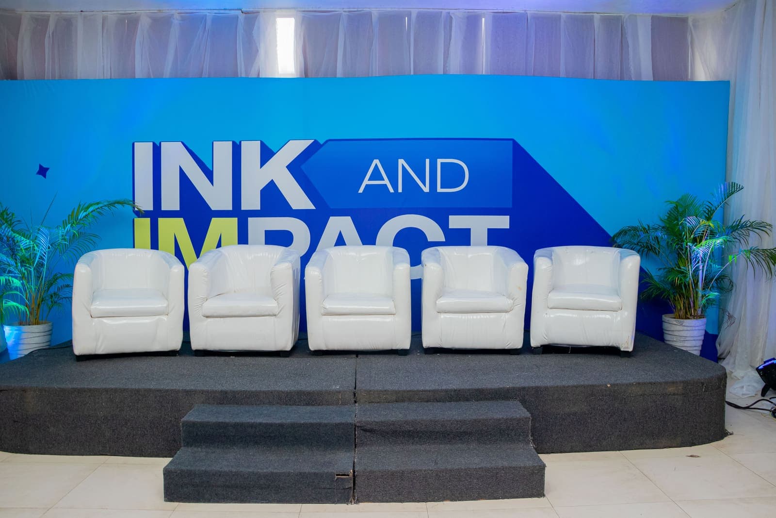 The stage set before the room filled at Ink & Impact 1.0