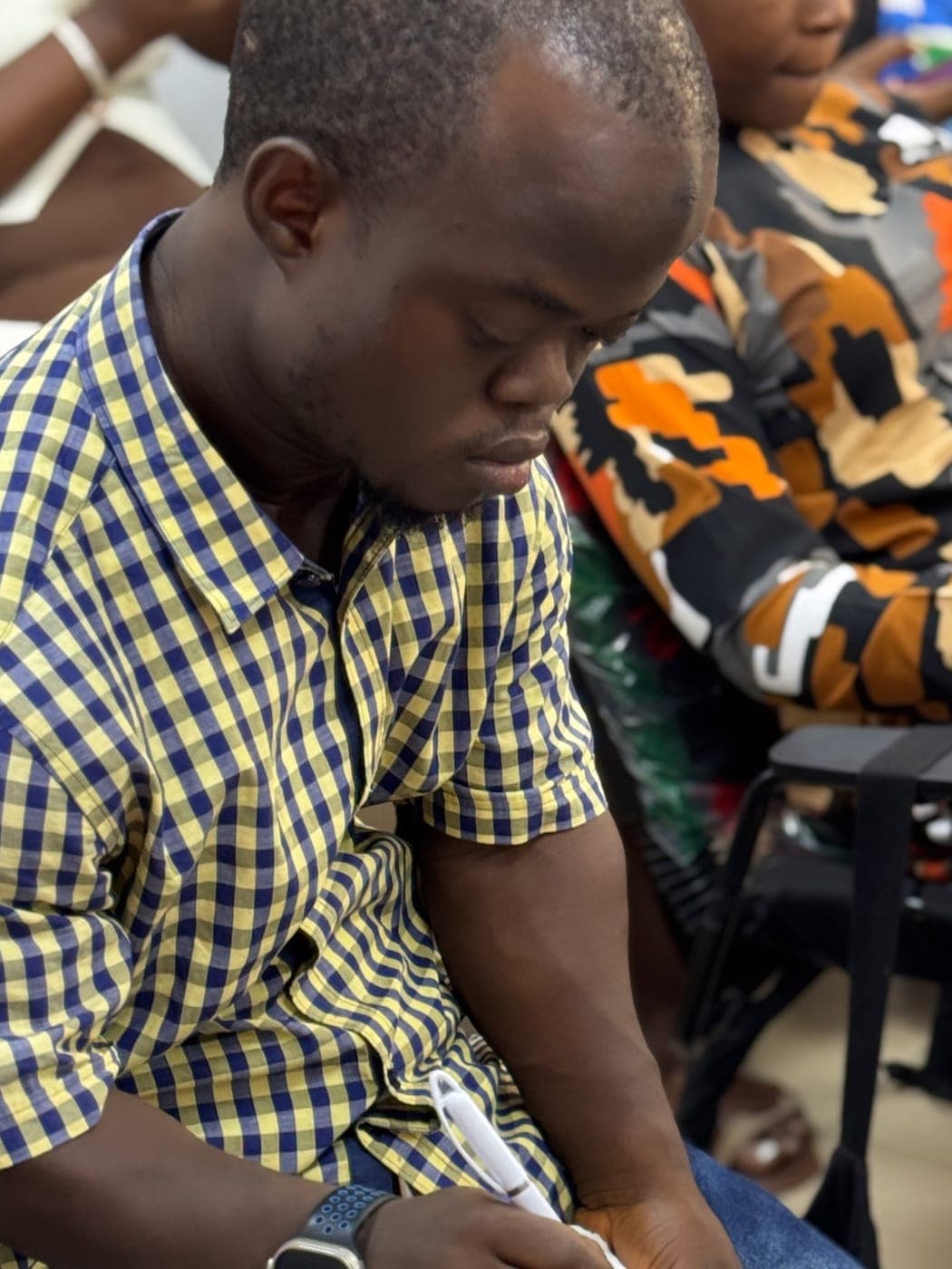 A member taking notes during a session