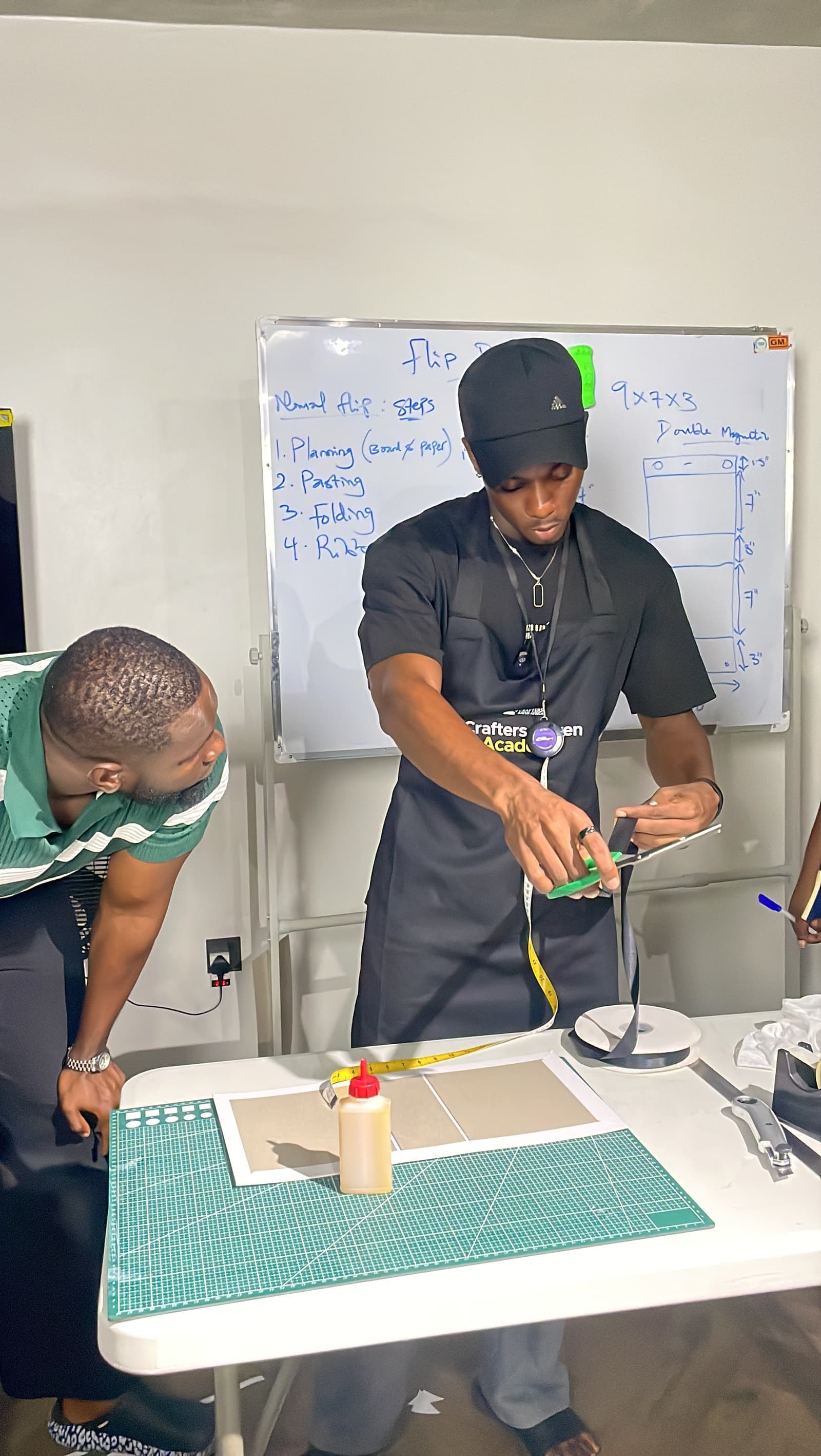 A trainer demonstrating box construction