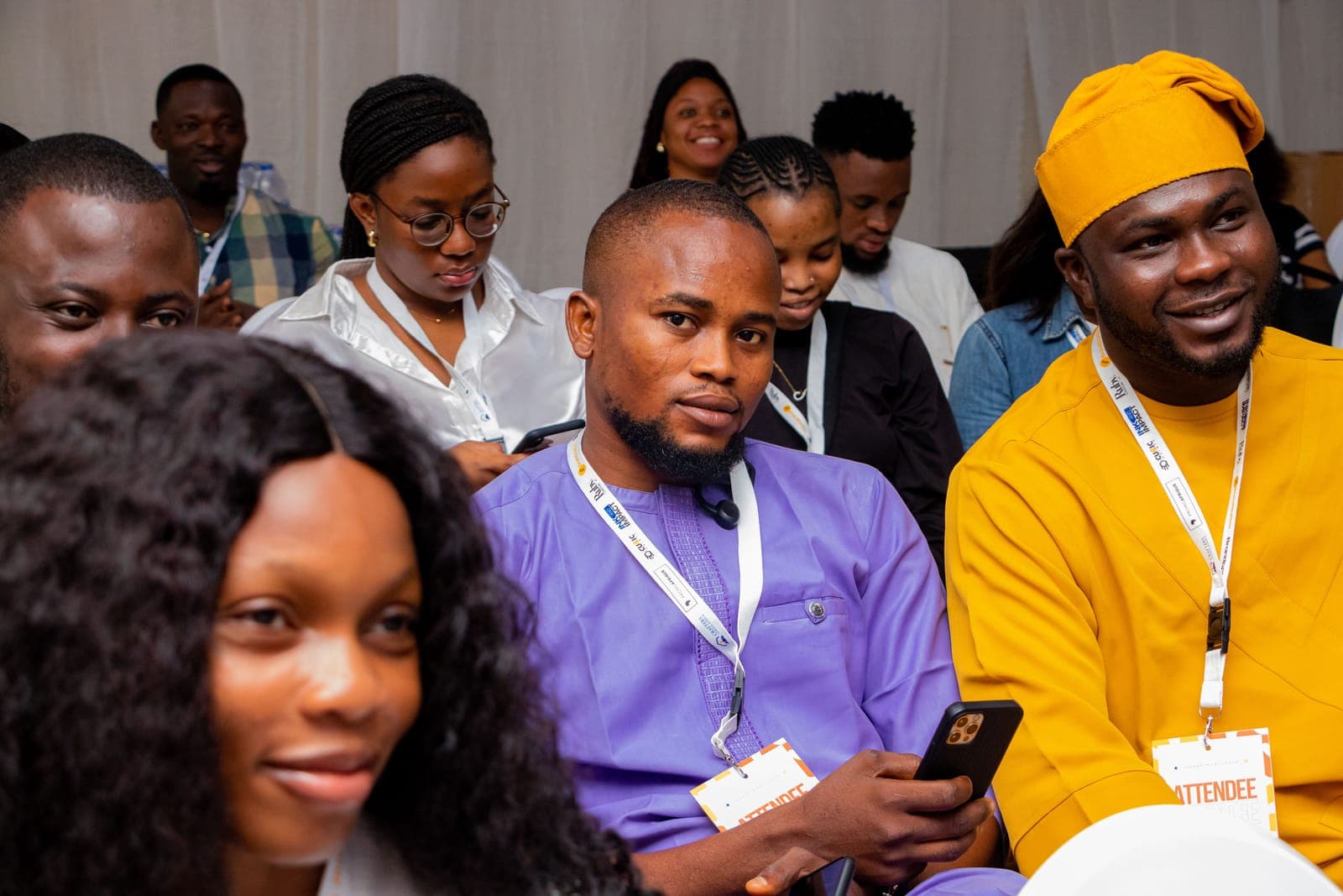 Members seated together at Ink & Impact