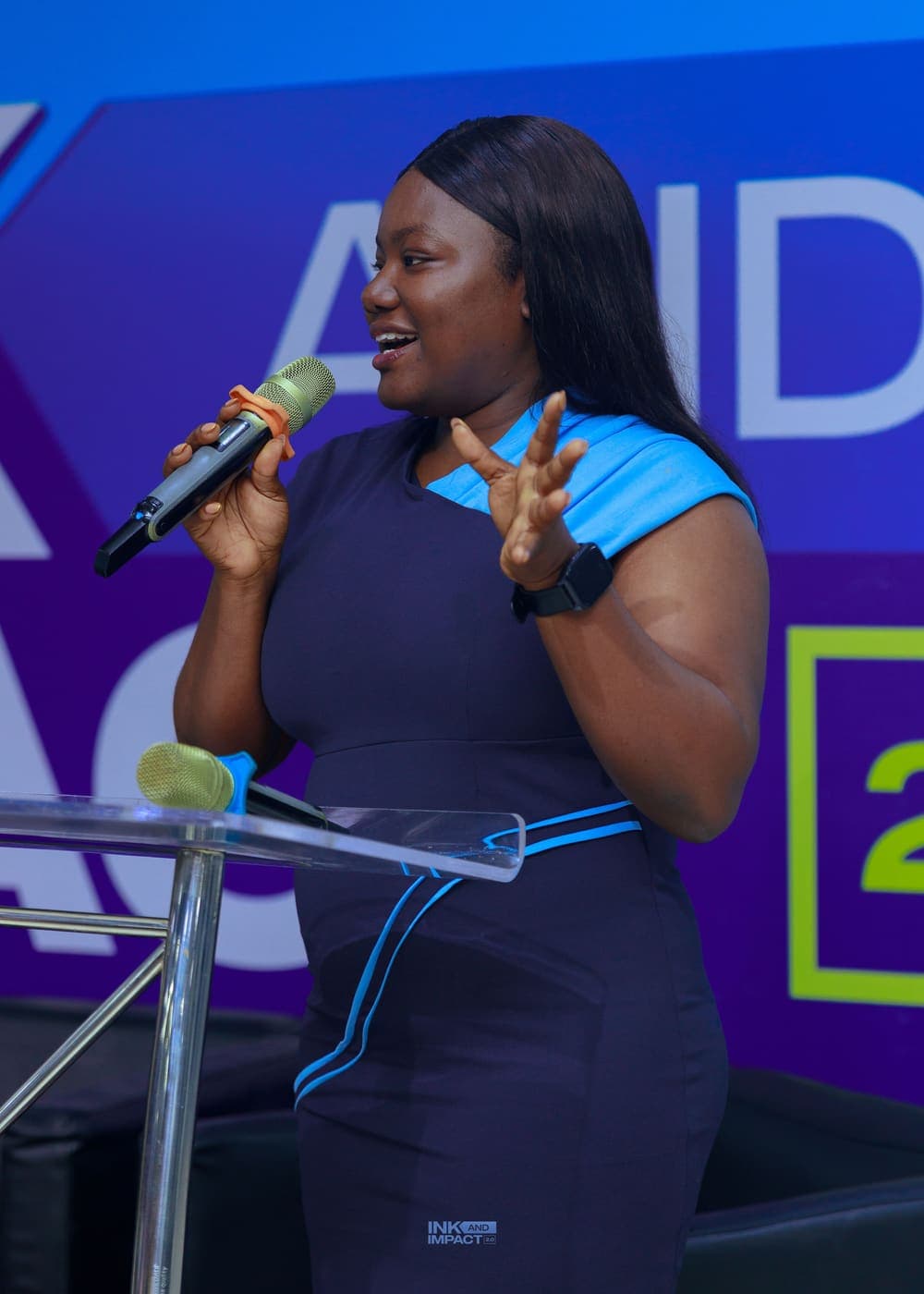 A member speaking to the room at Ink & Impact 2.0
