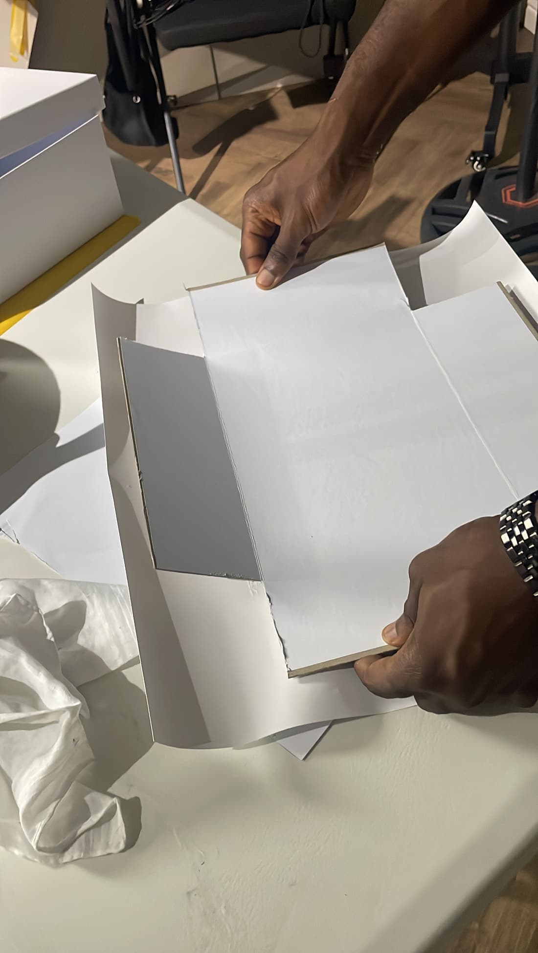 A box taking shape from folded board