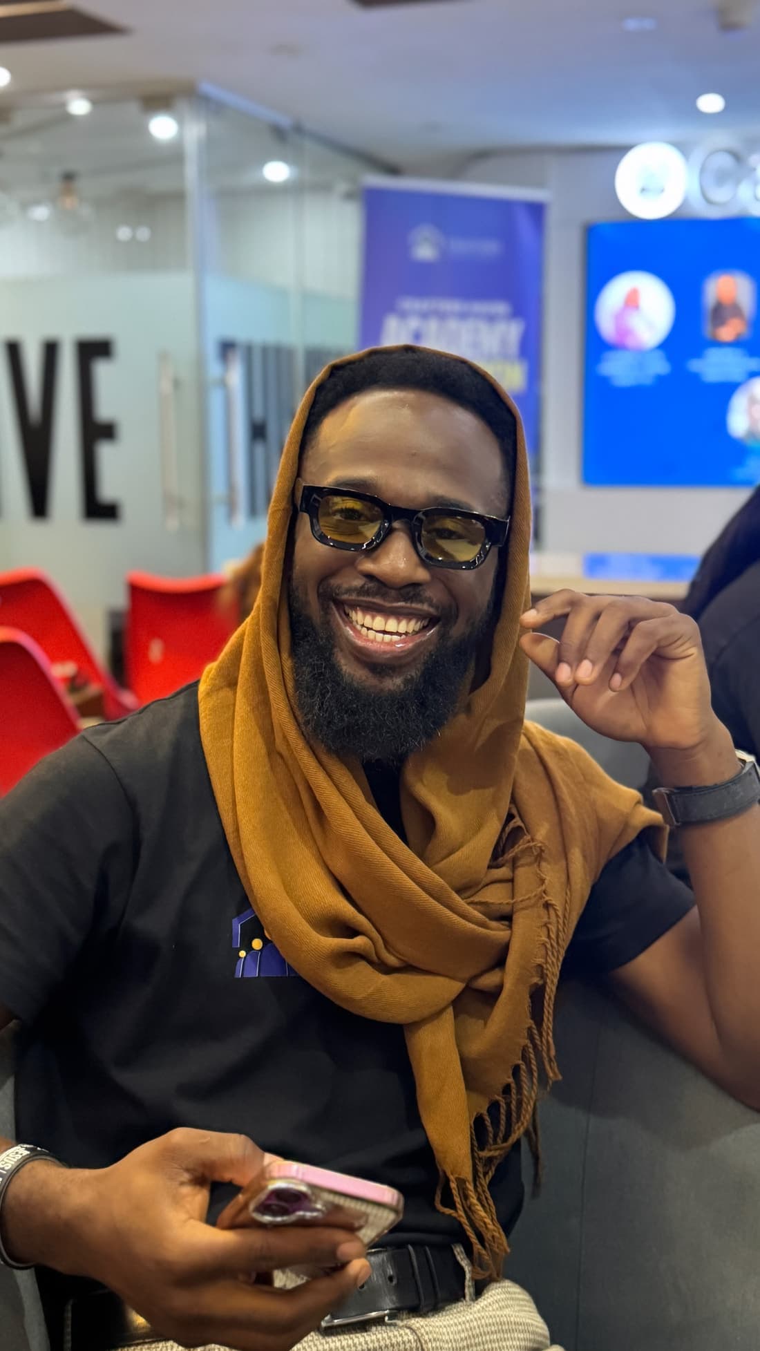 A member laughing between sessions at a Cohort 1 training day