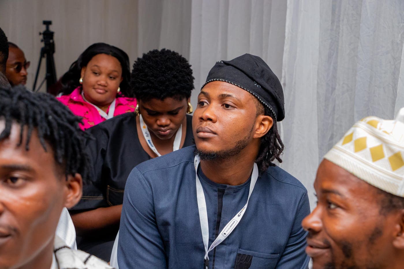 Members listening through a session at Ink & Impact