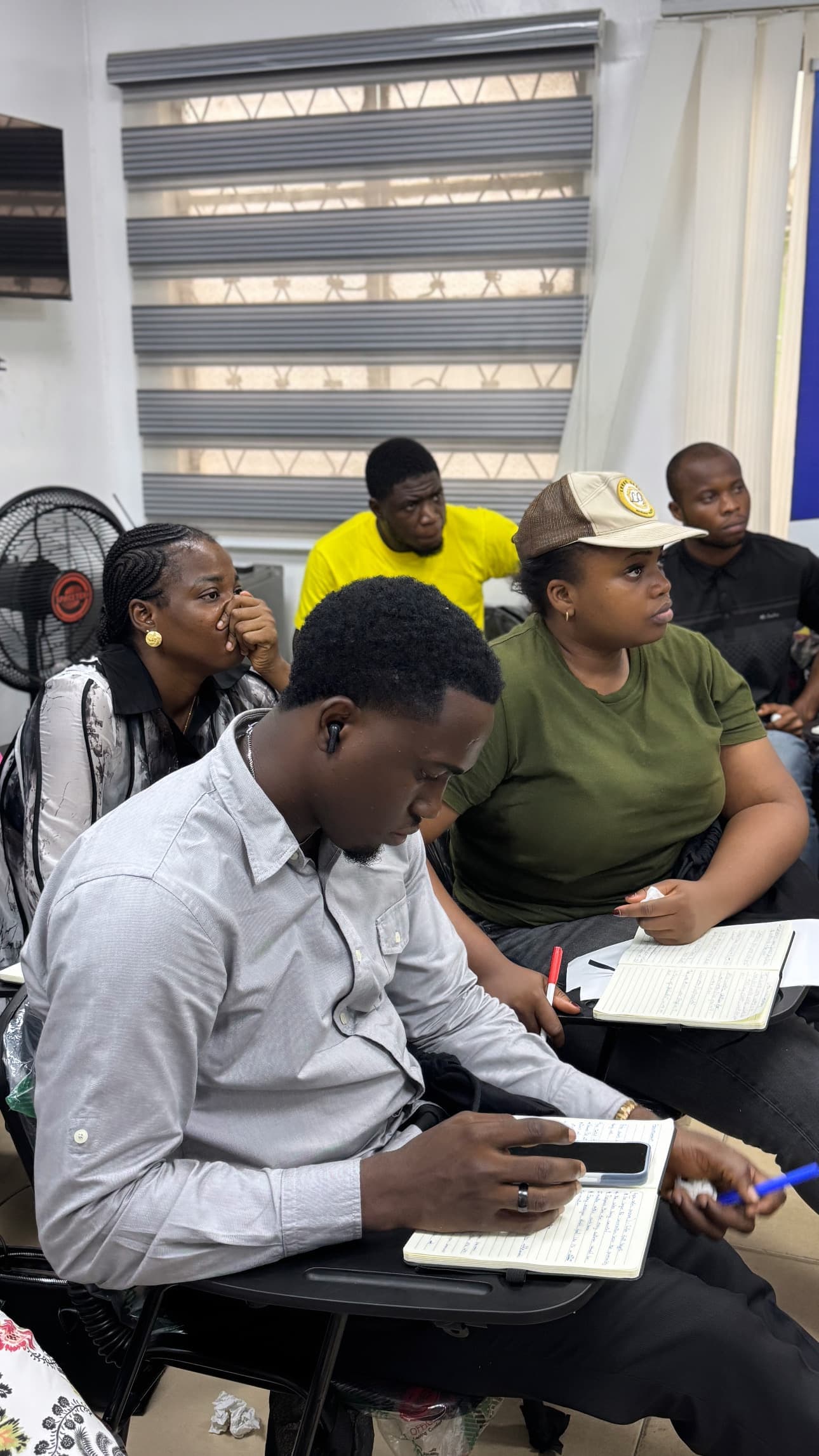Members working through a brief alongside their peers